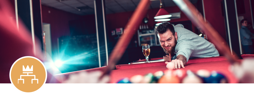 Man playing pool in a bar