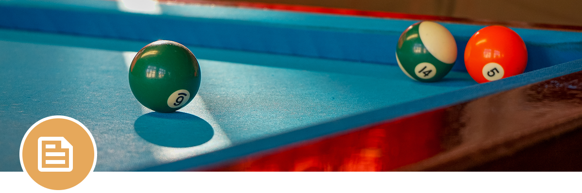 Billiard balls near pool table edge