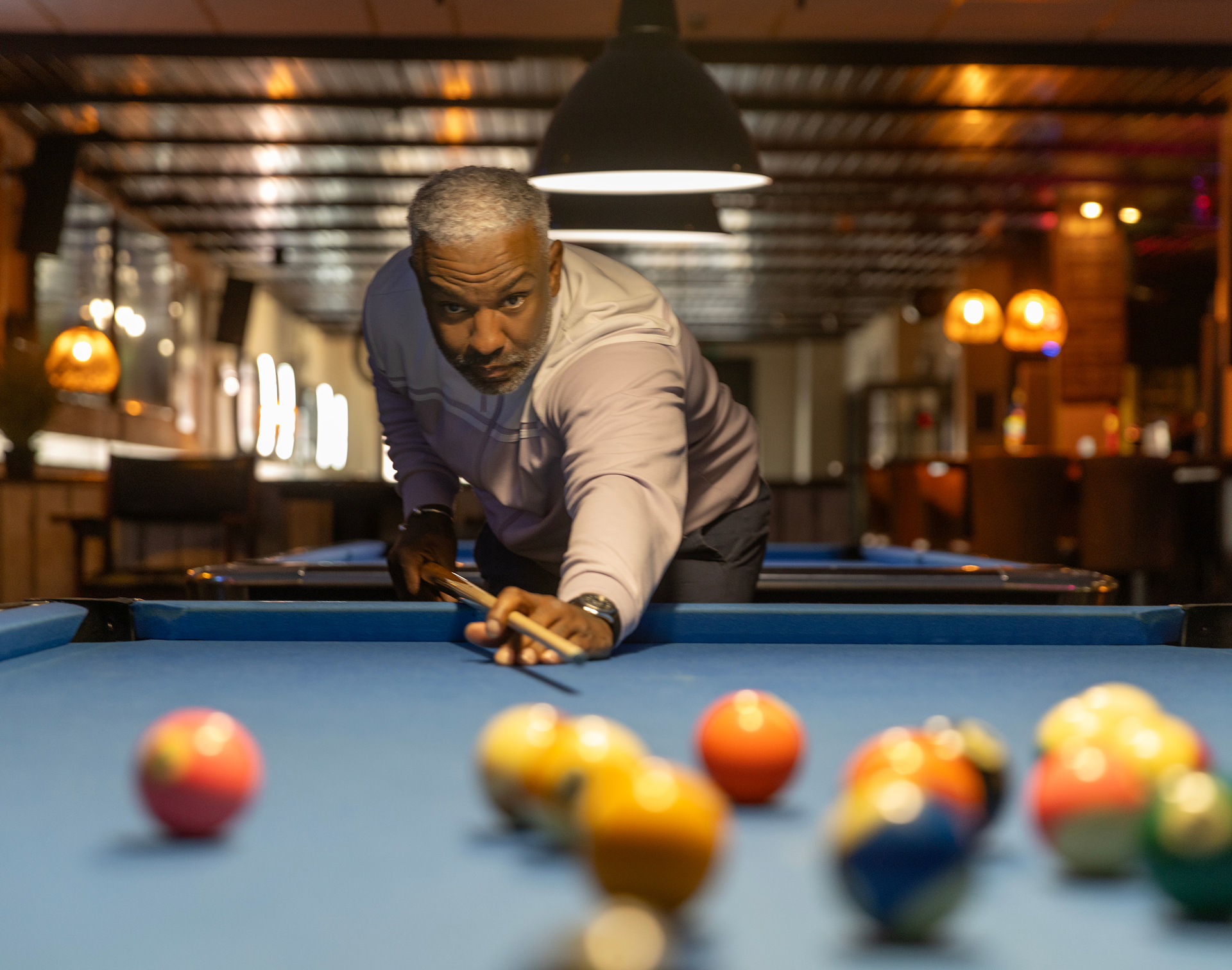 Man aiming in a pool game