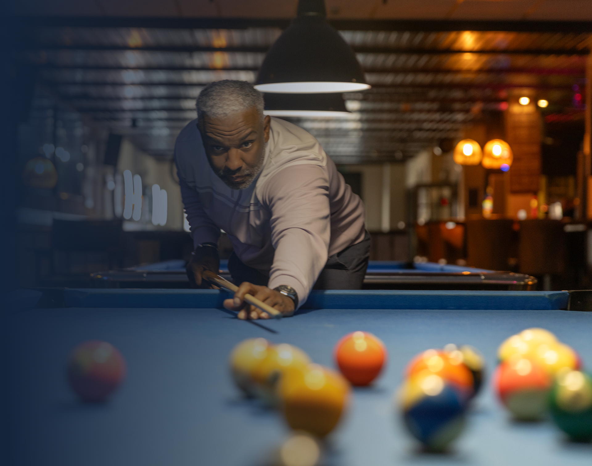 Billiards player concentrating on the game