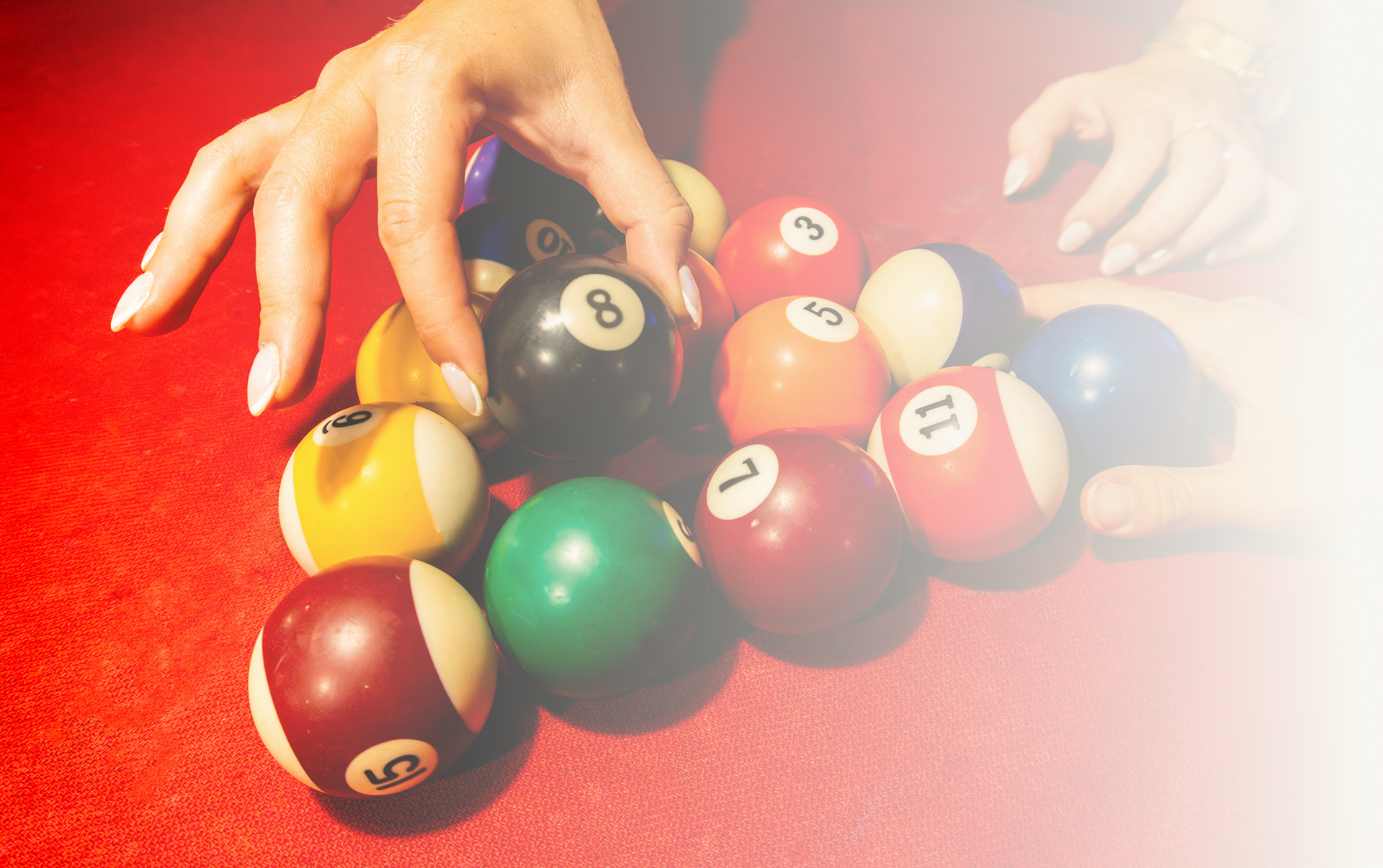 Close-up of billiard balls on red table